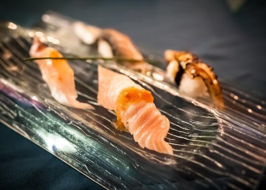 Course 7: Suzuki (striped bass) nigiri with tobiko, seared albacore tuna belly nigiri, saba (mackerel) nigiri with candied kombu, black cod 'faux-nagi' (made to taste like unagi)