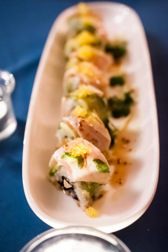 Course 8: Golden State Roll - uramaki filled with scallops, Sriracha, and green apple, and topped with avocado, albacore, masago, and an apple spice reduction. All ingredients are local.