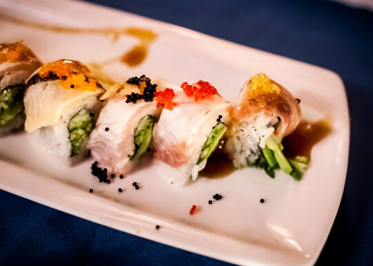 Course 8: Tataki Roll - uramaki filled with avocado, cucumber, and topped with albacore, arctic char, black cod 'faux-nagi', and multi-colored tobiko.