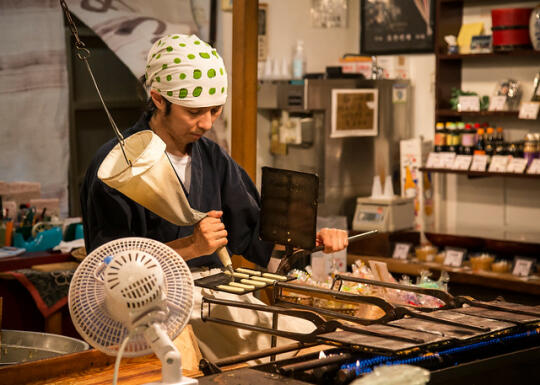 Man making senbei