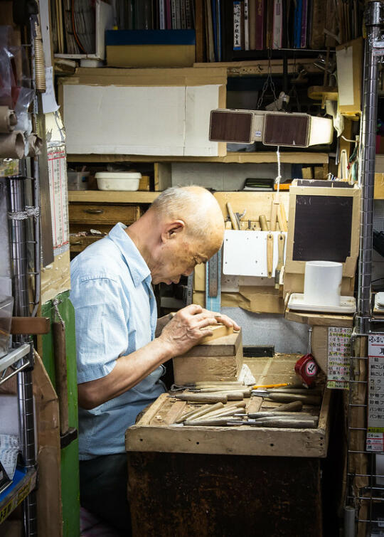 A man carving wood