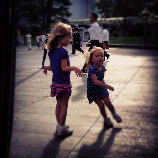 Rachael's girls running around beneath the spider statue