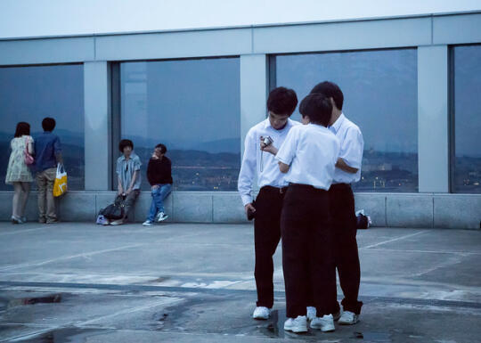 Schoolkids looking at one of their cameras