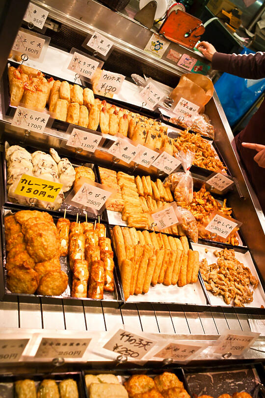 Shrimp, hot dogs, and mochi wrapped in what looks like fish cakes, at Nishiki Market