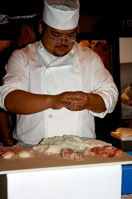 Sushi Chef making Nigiri Sushi