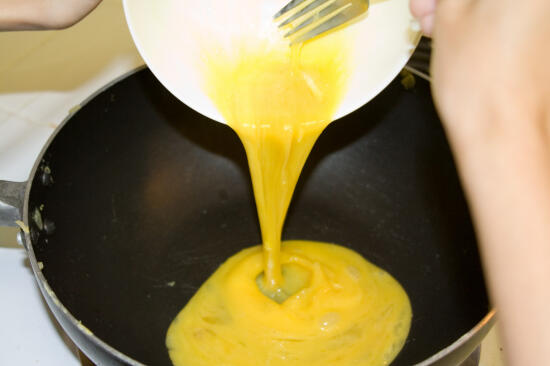 Pouring the egg mix into the pan