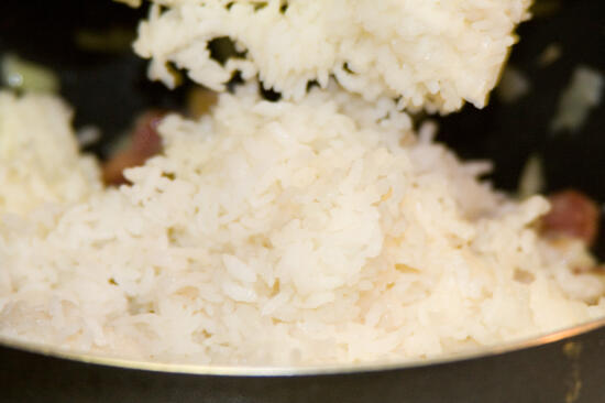Put the rice into the pan