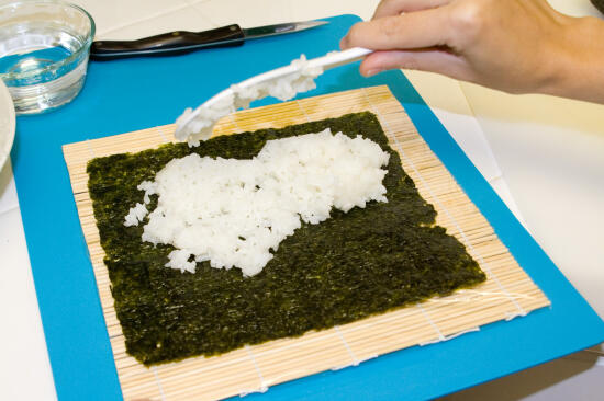 Placing the rice on the nori