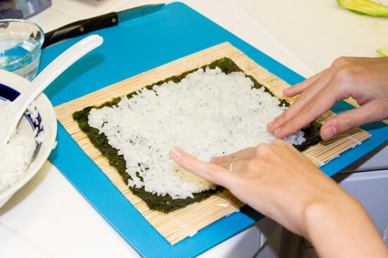 Spread the rice over the entire sheet of nori