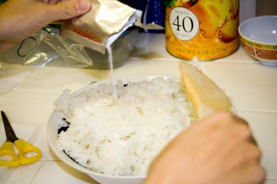 Pouring the seasoning in the rice