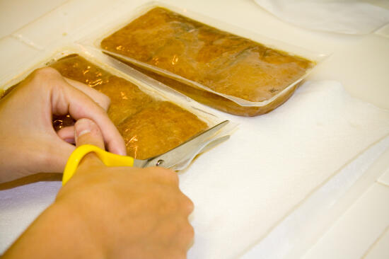 Cutting open the aburaáge packets