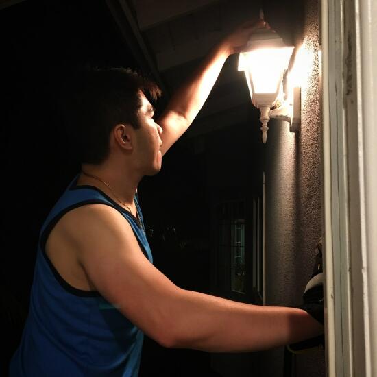 Son installing a light