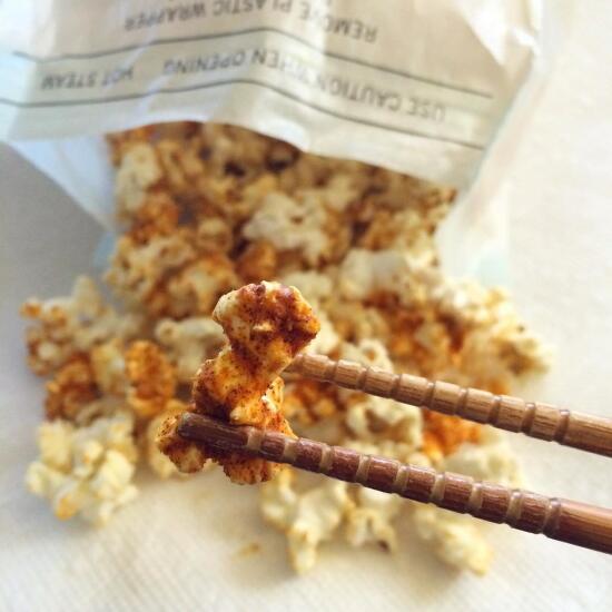 Eating popcorn with chopsticks