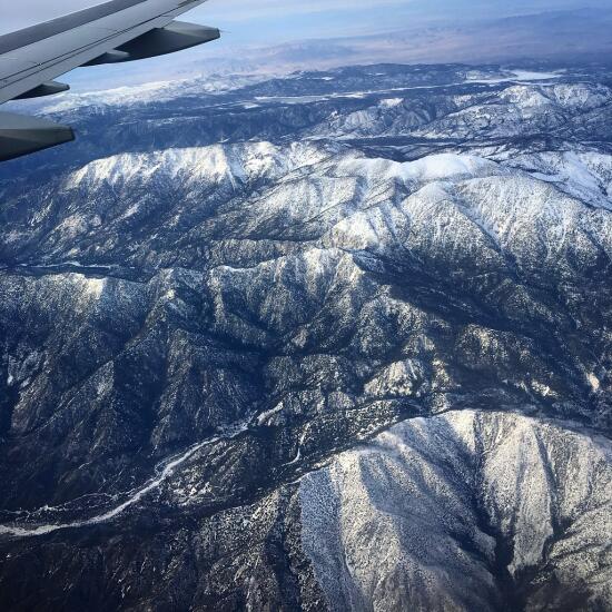 Flying over snow-capped mountains