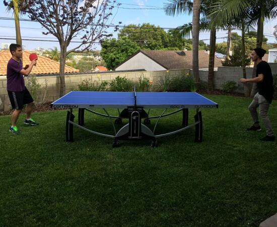 Son and Patrick playing ping pong