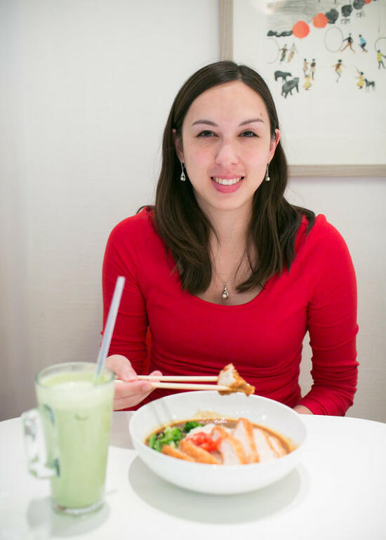 Allison at Tombo Japanese restaurant, with her katsu curry and matcha latte