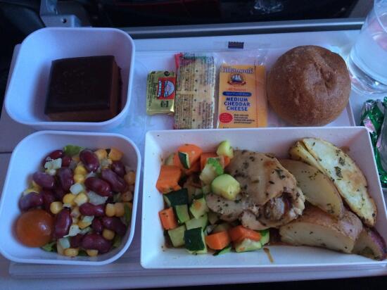 garlic chicken with potatoes, veggies, corn and bean salad, bread/butter, cheese/crackers, orange chocolate mousse