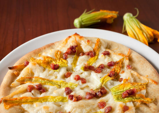 Zucchini blossom and pancetta pizza