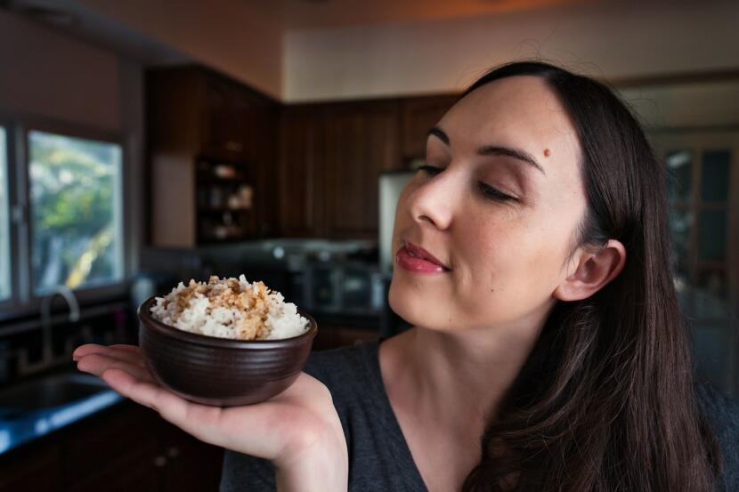 Allison holding a bowl of teriyaki sauce